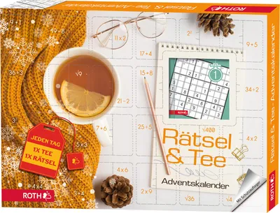 A flat lay of an advent calendar with a cup of tea, glasses, and a pine cone.