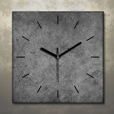 A square clock with a concrete texture and black hands against a textured background.