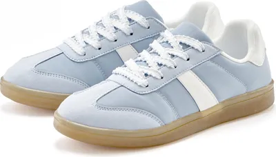 A pair of light blue and white sneakers with tan soles, shown from a diagonal angle against a white background.