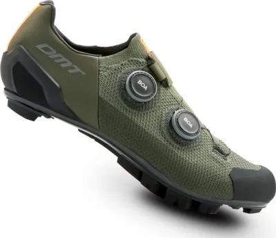 A single green cycling shoe is shown against a white background.