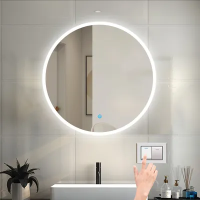 A bathroom scene with a round LED mirror, a sink, and a hand touching a light switch.