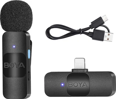 A product shot of a wireless microphone system, including the microphone, receiver, and charging cable, against a white background.
