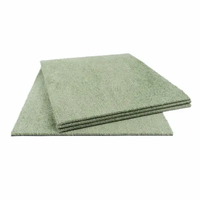 Several stacked carpet tiles on a white background.