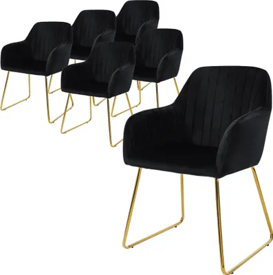 A set of six black velvet dining chairs with gold legs are arranged on a white background.