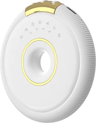 A white and gold mini white noise sleeper and Bluetooth speaker.
