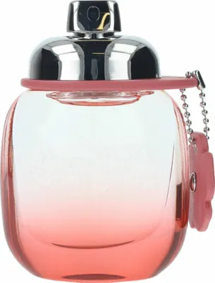 A perfume bottle with a pink gradient and a silver cap.
