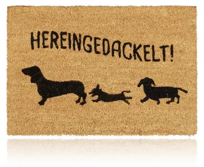 Productafbeelding van Relaxdays deurmat van kokosvezel, model "Hereingedackelt", kokosmat met hondenmotief, geschikt voor binnen en buiten, deurmat 40x60 cm, naturel, AI-gegenereerde afbeelding
