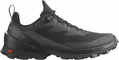 A black Salomon trail running shoe is shown from a side-angle on a white background.