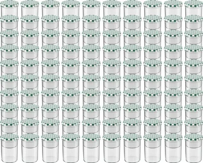 A grid of identical glass jars with green and white checkered lids.