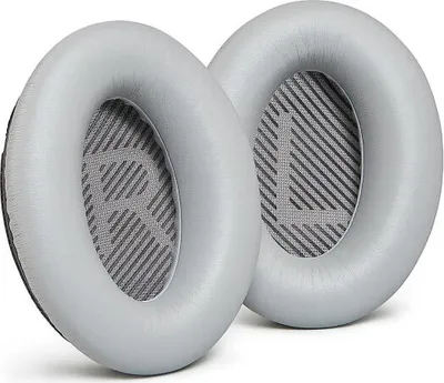 Two gray ear pads for headphones are shown against a white background.