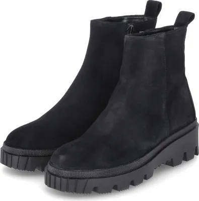 A pair of black suede ankle boots with thick soles are displayed against a white background.