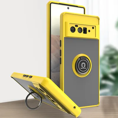 A yellow and gray phone case with a ring holder is displayed on a table.