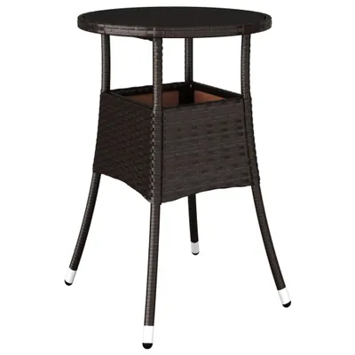 A brown poly rattan garden table with a glass top and a built-in planter.