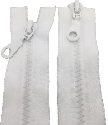 Two white zippers are laid out side-by-side against a white background.