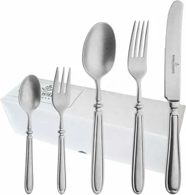 A set of cutlery laid out on a white box.