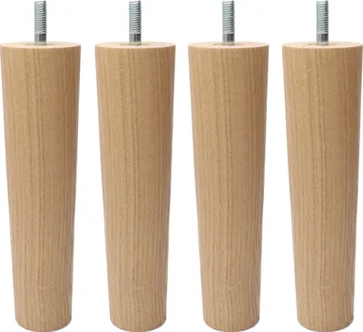 Four wooden furniture legs with metal screws on a white background.