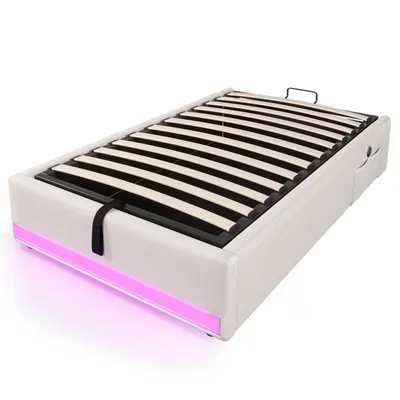 A white bed frame with a slatted mattress support and LED lighting along the bottom.