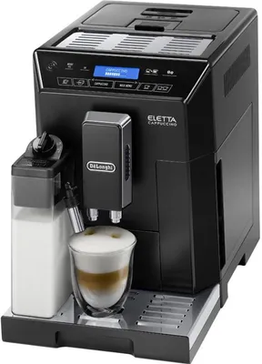 A black DeLonghi Eletta Cappuccino coffee machine is shown with a glass of cappuccino in front of it.