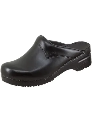 A black Sanita clog shoe is shown against a white background.