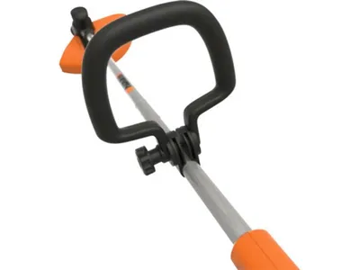 Close-up view of the handle and shaft of a string trimmer.