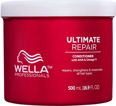 A red tub of Wella Professionals Ultimate Repair Conditioner.
