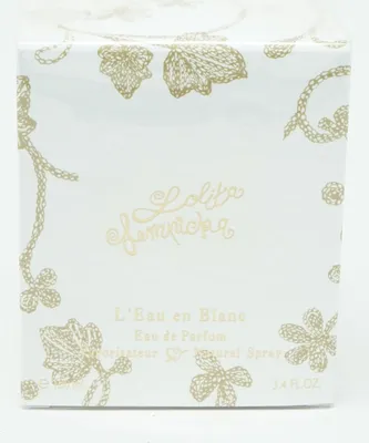 A white box with gold floral patterns and text.