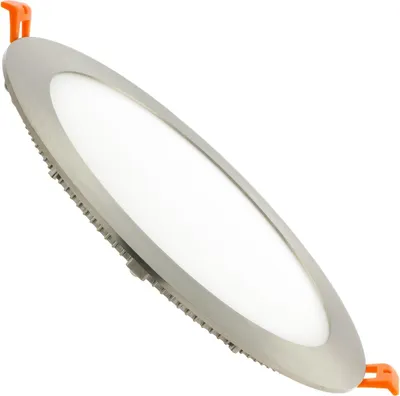 A close-up, angled studio shot of a round, flat LED recessed light fixture against a white background.
