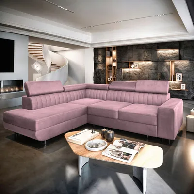 A pink sectional sofa in a modern living room with a spiral staircase and a fireplace.