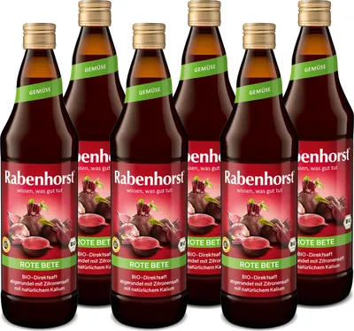 A group of six bottles of Rabenhorst Rote Bete juice arranged in a row.
