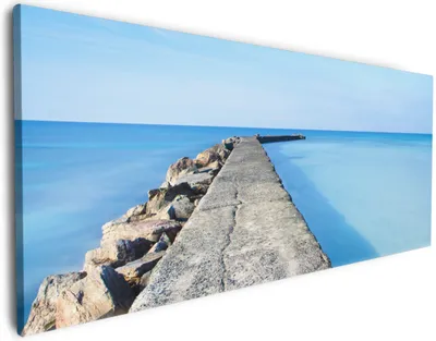 Produktbild von Wallario Premium Leinwandbild Pier am blauen Ozean mit blauem Himmel in Größe 50 x 125 cm