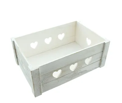A white wooden crate with heart cutouts on a white background.