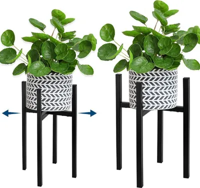 Two identical plant stands with potted plants, showing the adjustable width with arrows.