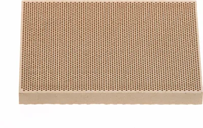 A close-up, straight-on view of a ceramic honeycomb soldering plate.