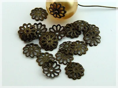 Produktbild von Vintageparts Perlkappen filigran antik Bronze 8 mm, 50 Stück
