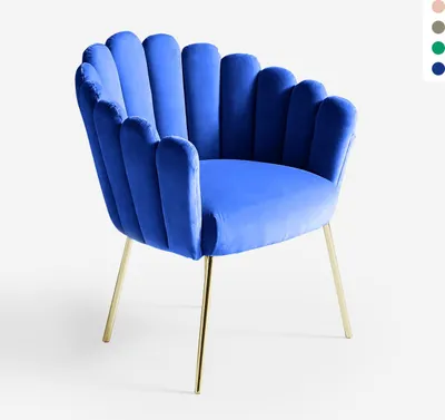 A blue velvet armchair with gold legs is shown against a white background.