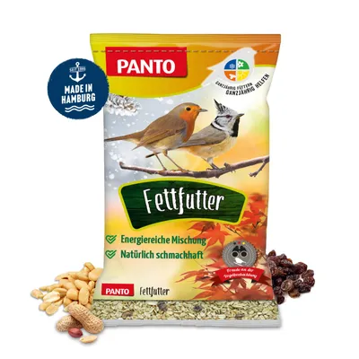 A bag of bird food with peanuts and raisins scattered around it.