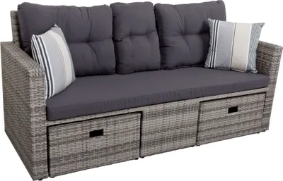 A gray wicker outdoor sofa with dark gray cushions and striped throw pillows.