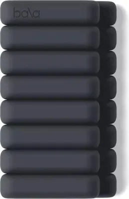 A stack of dark gray Bala Bangles wrist/ankle weights.
