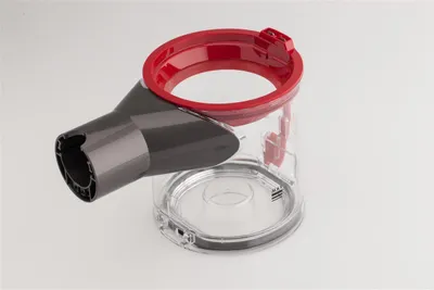 A clear studio shot of a vacuum cleaner dustbin component.