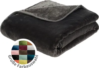A folded dark gray plush blanket with a lighter gray lining is shown on a white background. A circular graphic with swatches of various colors and text is overlaid on the bottom left corner.