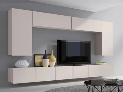A modern media console with a TV and decorative items.