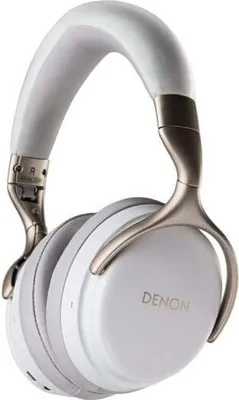 A studio shot of white Denon headphones against a white background.