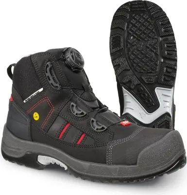 A pair of black safety boots with red accents and a grey sole, shown against a white background. The sole of one boot is visible in the background.