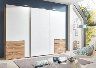 Produktbild von Kleiderschrank "Level36 A" aus Spanplatte in Plankneiche-Nachbildung mit 6 Schubladen und 3 Türen. Abmessungen (B/H/T) 300x216x65 cm