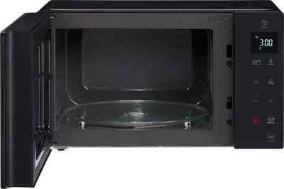 An open black LG microwave with a glass turntable inside, set against a white background.