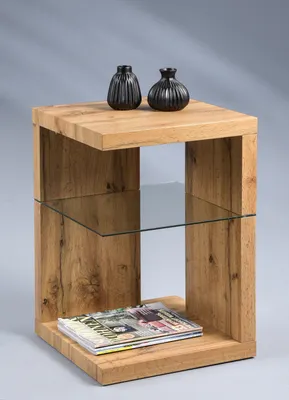 A wooden side table with a glass shelf, decorated with two black vases and a magazine.