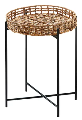 A round woven tray table with a black metal base.