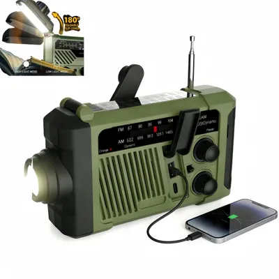 A green emergency radio with a flashlight and a phone charging from it.