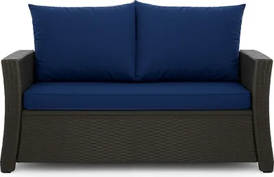 A front view of a dark gray wicker outdoor loveseat with blue seat and back cushions.