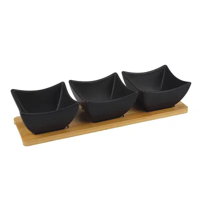 Three black square bowls on a wooden tray against a white background.